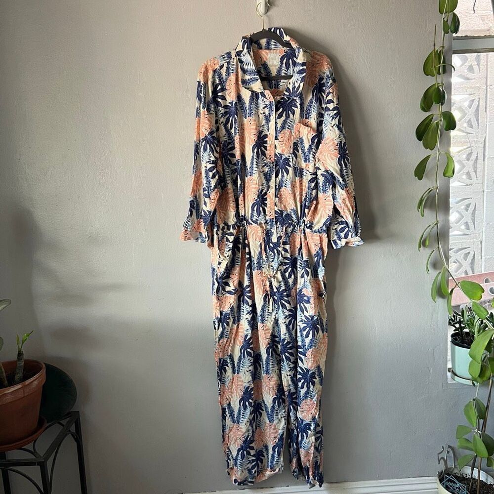 MUK LUKS Dream Weave Long Sleeve Jumpsuit featuring a palm leaf pattern in blue